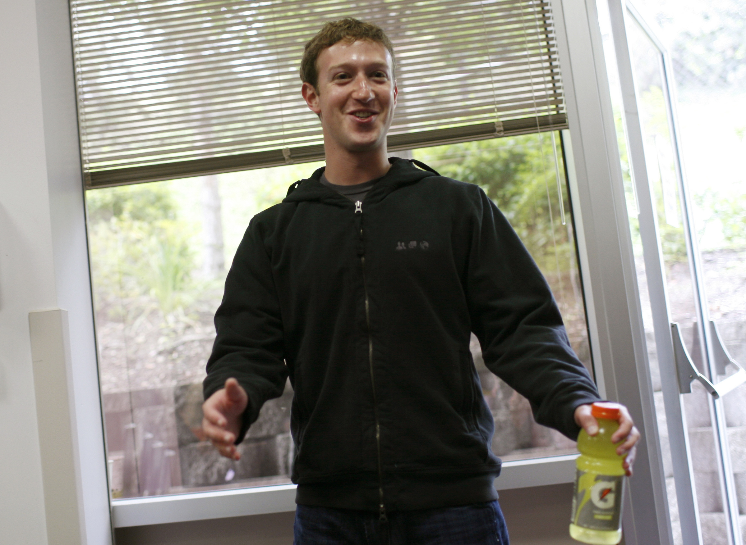 Facebook CEO Mark Zuckerberg reacts prior to a news conference at Facebook headquarters in Palo Alto. Reuters